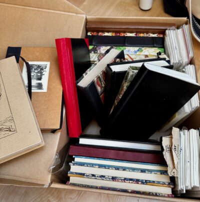 box of journals and notebooks from the 1980s and 1990s