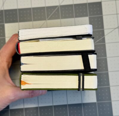 stack of sketchbooks comparing thickness of stillman and birn, leda, hahnemuhle and handbook journal